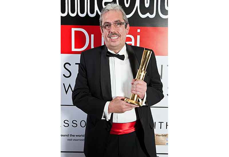 Uwe Micheel collects his award at the 2012 Time Out restaurant awards